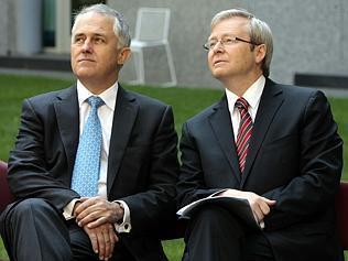 Liberal MP Malcolm Turnbull (L) and Prime Minister Kevin Rudd at Federal Parliament House in Canberra where Rudd presented th...