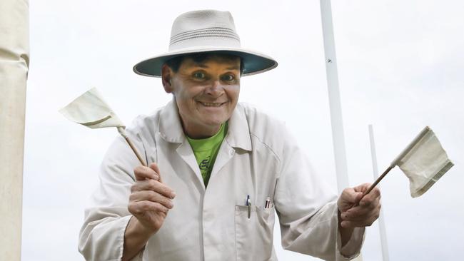 Greenacres Footy Club goal umpire Dave Crispin with his tiny flags, one of about five sets in his kit bag. Picture: AAP/Dean Martin