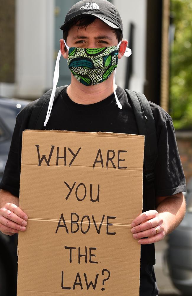 A protester outside the home of Dominic Cummings. Picture: AFP