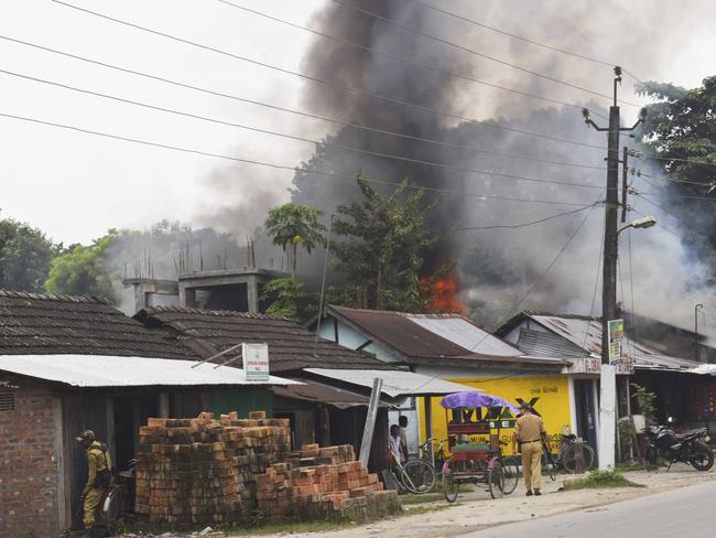 A fire burns after rebels opened fire in a crowded market at Kokrajhar, in the northeastern Indian state of Assam, India. Picture: AP Photo