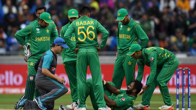 Pakistan’s Wahab Riaz lies on the pitch after picking up an injury in the loss to India.