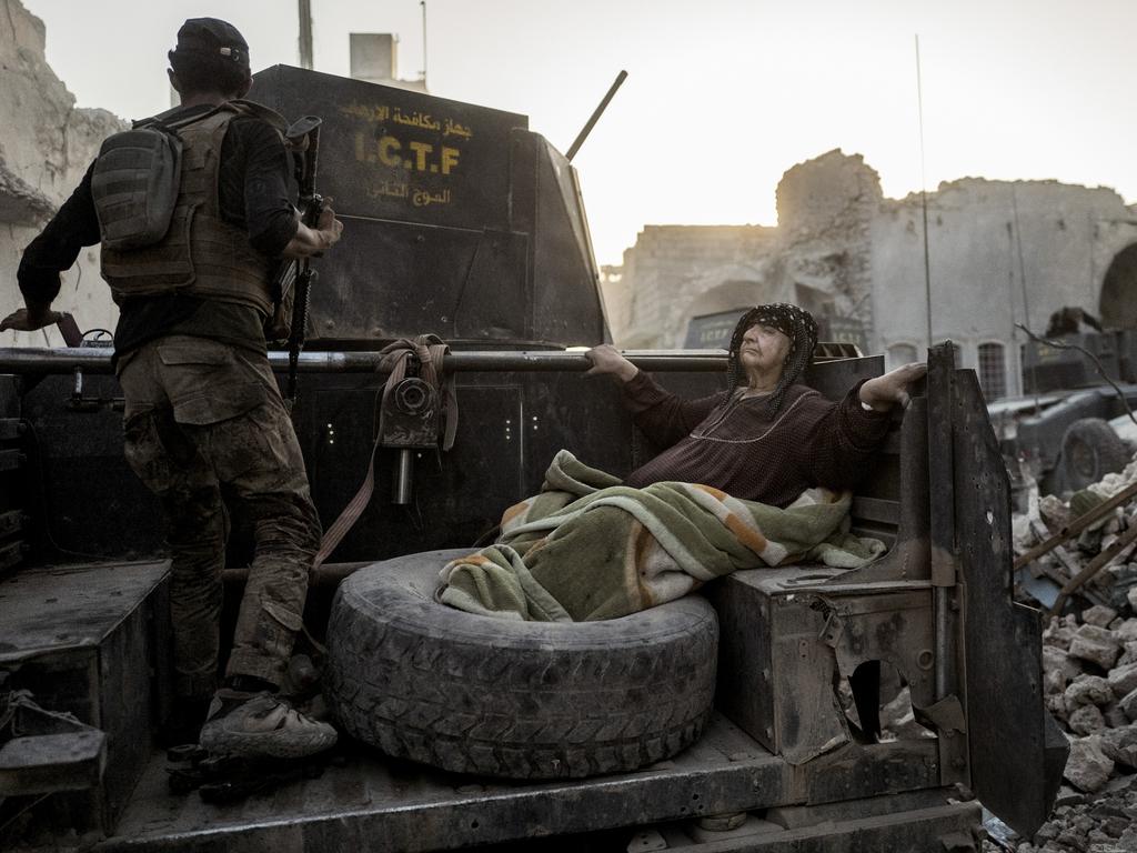 Image Name: Mosul liberated Photographer Name: Rasmus Flindt Pedersen An elderly woman is driven through the city on the back of one of Golden Division’s Humvees. The temperature is nearly 50 degrees celcius, and she’s too weak to get away from the frontline on her own. 11 days later - 10. July 2017 - the Iraqi prime minister, Haider al-Abadi, declares Mosul liberated, although fighting continues in the city for a couple of weeks. Series Name: Mosul liberated Series Description: On 16. October 2016 a coalition of Iraqi and Kurdish military forces launch operation ‘We are coming, Nineveh’ - the fight to retake the Iraqi city Mosul and the surrounding area from ISIS. Nine months later Mosul is declared liberated. An AP report estimates that upwards of 11,000 civilians have been killed during the war, and according to the International Organisation for Migration more than 800,000 people have fled their home. The series is shot over the course of 16 days during two separate trips to Mosul, Iraq in January/February 2017 and June/July 2017 in order to document the war to liberate Mosul from ISIS. Picture: Rasmus Flindt Pedersen, Denmark, Shortlist, Professional, Current Affairs; News (Professional competition), 2018 Sony World Photography Awards