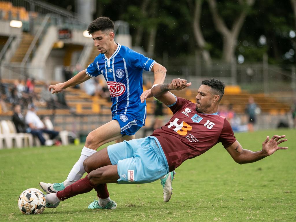 Themba Muata-Marlow delivering a slide tackle on Olympic player Jaden Casella. Picture: Julian Andrews