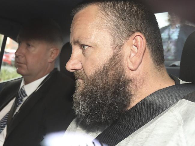 Arriving at the City Watch House, Steven Hainsworth ,  suspect in the murders of Stephen Newton , Beverley Hanley and Phyllis Harrison . He is to be extradited from Melbourne today. 16 May 2019. Picture Dean Martin .