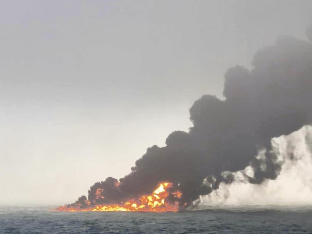 Smoke billows from the stricken vessel. Picture: AP