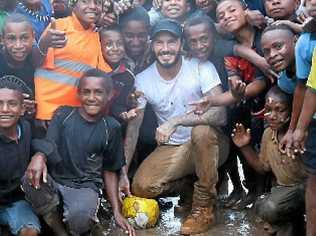 David Beckham with local children in Kumnga Village in the Western Highlands Province of Papua New Guinea. Picture: PHOTO Jackie Nickerson