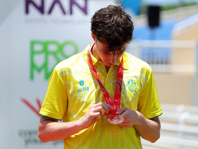 Jack Latham checks out his bronze medal. (Photo by Kevin C. Cox/Getty Images for Commonwealth Sport )