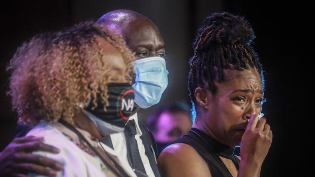 Actress Tiffany Haddish, right, wipes away tears as she stands with civil rights attorney Ben Crump and Eric Garner's mother Gwen Carr, at a memorial service for George Floyd. Picture: AP