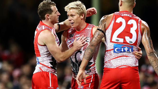 Isaac Heeney (celebrating a goal with Harry Cunningham and Lance Franklin) was a clear standout for the Swans. Picture: Getty Images