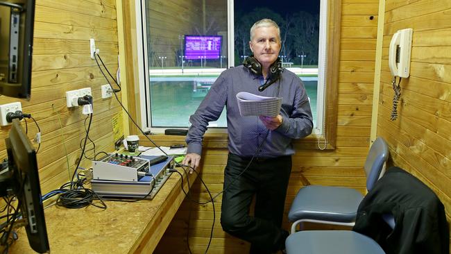 The voice of Gosford greyhounds racing, John McDermott, in his racecaller’s area perched above the home straight.