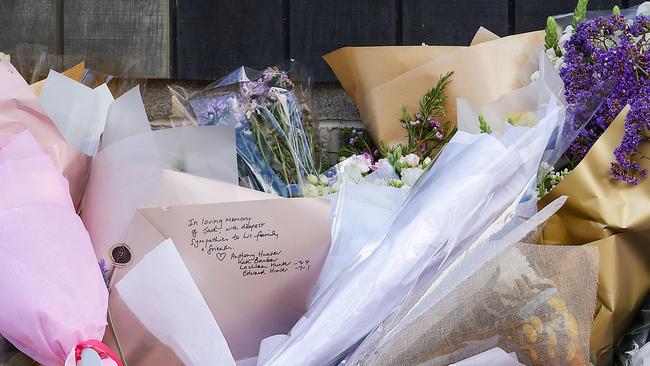 Flowers, messages and a football were left outside Auburn South Primary School in Hawthorn East on Wednesday. Picture: NewsWire/Ian Currie