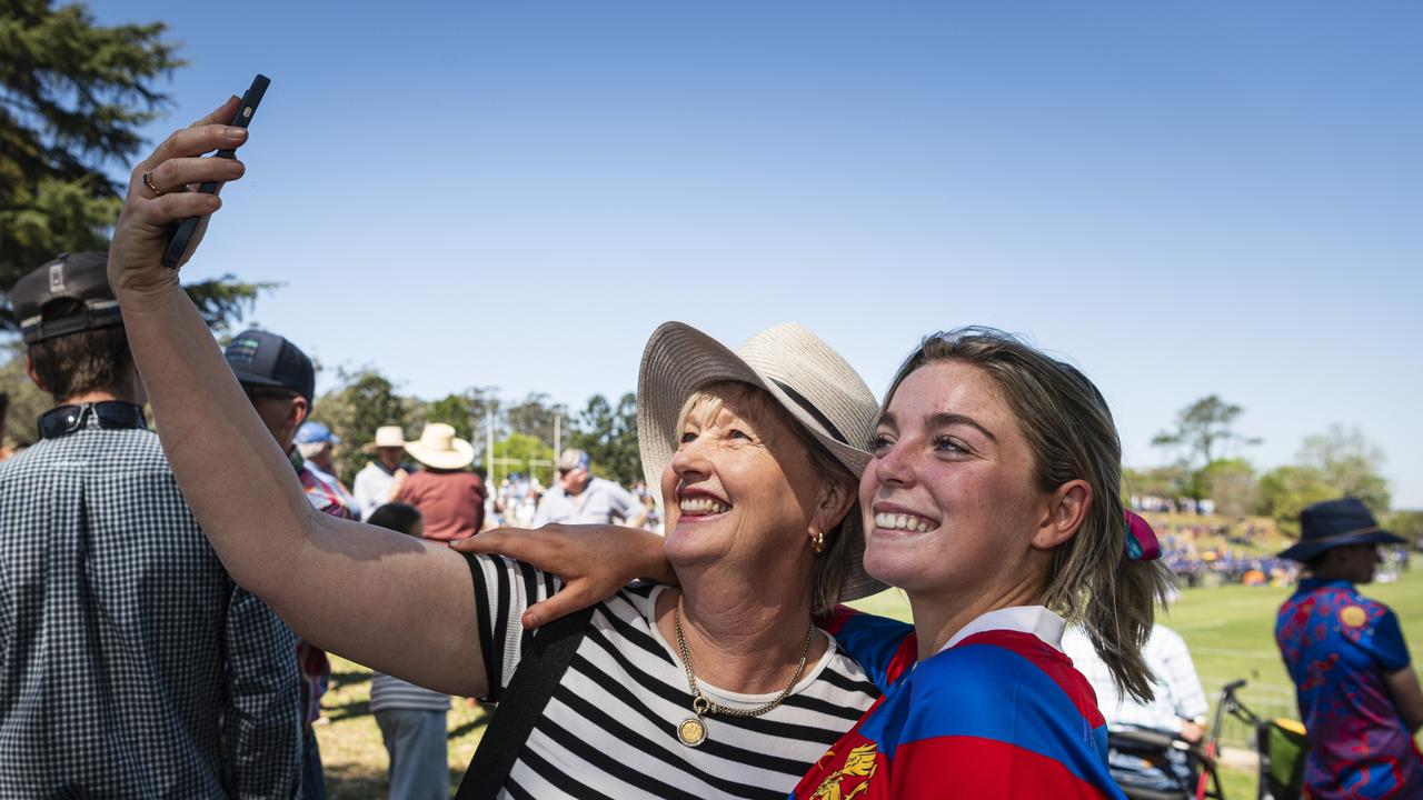 Jo Clark takes a picture with her former primary school student Georgina Loughnam after they reunited. Picture: Kevin Farmer