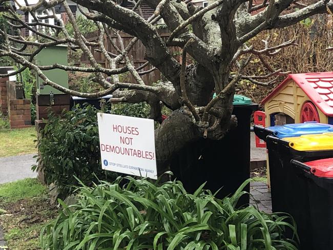 A sign installed by residents opposed to a bid by Stella Maris College at Manly to build eight demountable classrooms in Eurobin Ave. Picture: Manly Daily