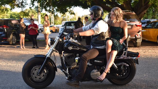 Courtney Calvert had a dramatic arrival on the back of a motorbike at her Pioneer State High School formal at the Mackay Golf Course on Friday November 20. Picture: Zizi Averill