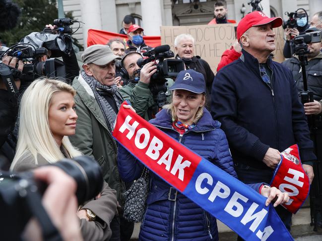 Dijana Djokovic (L) mother and Srdan Djokovic (R) father of Serbian tennis player Novak Djokovic attend a rally in front of Serbia's National Assembly. Picture: Getty