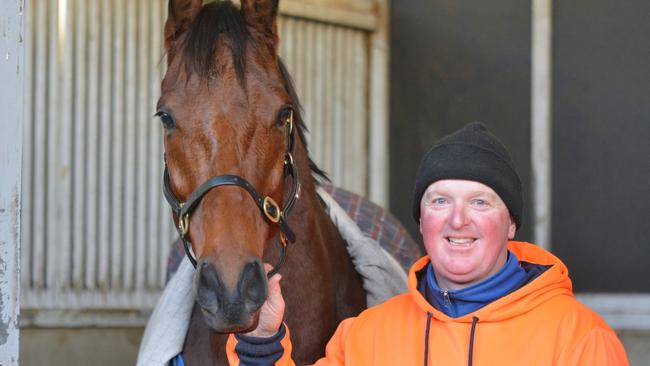 Horse Cunning Fox with trainer Adrian Duggan at his Brighton stables.