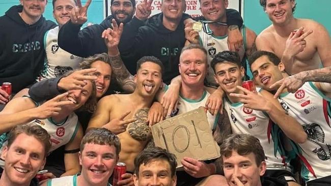 Nathan Gardiner holds the 101 sign as he celebrates his 100-goal milestone with his Cora Lynn teammates. Picture: Facebook