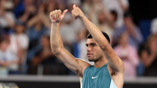 Spain's Carlos Alcaraz celebrates his victory against Kazakhstan's Alexander Shevchenko in the men's singles match on day two of the Australian Open (Photo by Martin KEEP / AFP)