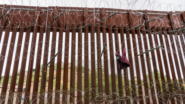 A jacket caught on the barbed wire of the US-Mexico border fence at Nogales, Arizona. Picture: Getty Images