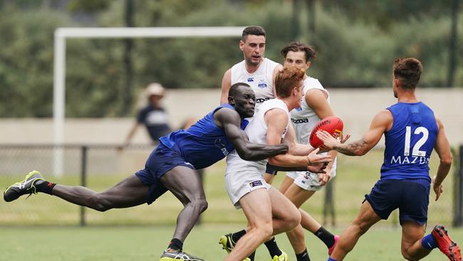 Majak Daw tackles strongly in North Melbourne’s intra-club. Picture: AAP Image/Michael Dodge