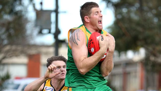 Jason Cloke of Spotswood marks on a strong lead during the WRFL match between Spotswood and  Werribee Districts played in Werribee on Saturday 23rd August, 2014. Picture: Mark Dadswell