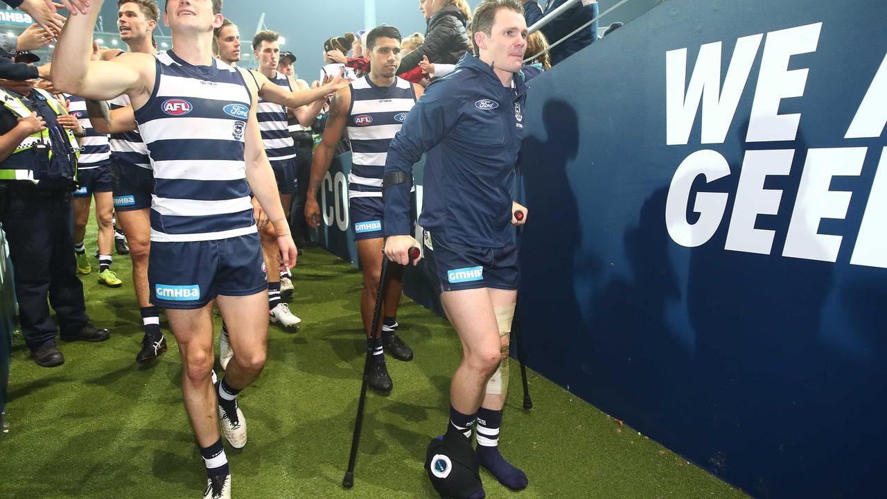 Patrick Dangerfield leaves the ground on crutches on Saturday night.