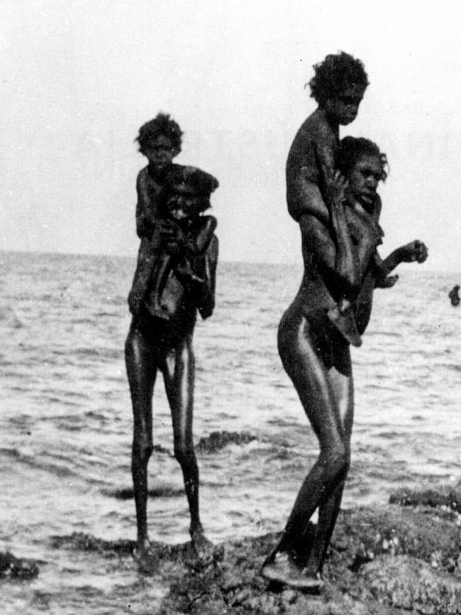 Aboriginal women carrying their children across water. Picture: from the book ''North Of Capricorn — The Untold Story of Australia's North'' by Henry Reynolds