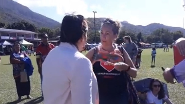 An anti-Adani protester speaks with Queensland MP Leeanne Enoch. Picture: Facebook/StopAdaniCairns