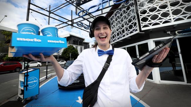 Merlo Coffee concierge Rachel Owen takes orders from drivers at the store in Fortitude Valley. Picture: Jamie Hanson