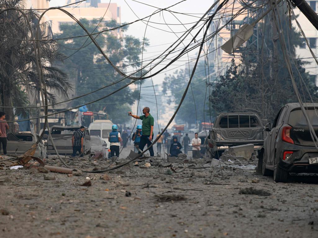 Residents check the damage following Israeli air strikes in Gaza City. Picture: AFP