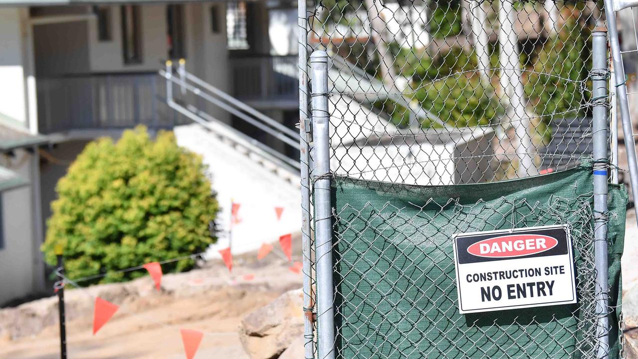 A construction company owned by billionaire Clive Palmer has been ordered to pay compensation to an accountant and an electrician caught up in a mass sacking on a Sunshine Coast building site last year.