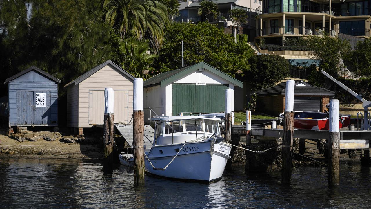 The boatshed (left) is next to other similar boatsheds on a coveted strip of Sutherland Shire water.