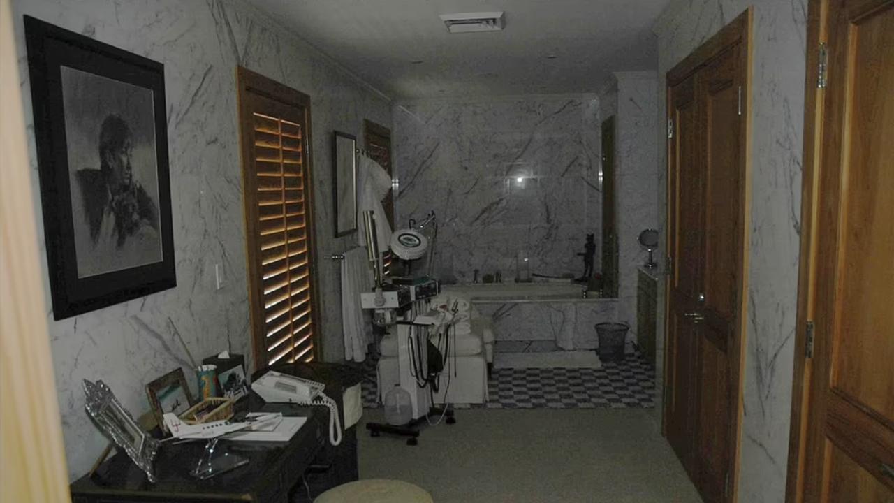 One of the snaps depicts the marble-walled room decked out with a massage table and a black desk. Picture: US District Attorney Office