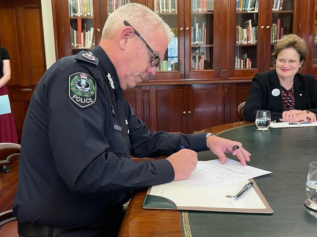 Police Commissioner Grant Stevens revokes the Covid-19 Major Emergency Declaration after 793 days at Government House on Tuesday, May 24. Governor Frances Adamson watches. Picture: Chris Picton