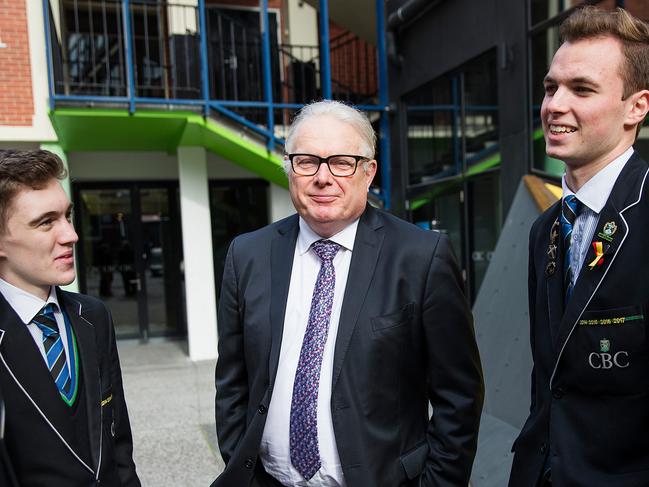 Principal of CBC Gerald Bain-King with students (L-R) Botie Chen, Zac Zabarauskas, Liam Taylor and Kelman Chen. Christian Brothers College in St Kilda has appealed to the Federal Government to review the SES score it has been allocated in order to determine its funding, after the diverse school with a large cohort of disadvantaged students received a similar score to the wealthy Haileybury College.  Photograph by Paul JeffersThe Australian29 June 2018