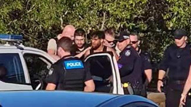 The woman is accused of being an accessory after the fact to murder, with police alleging she helped Ryan Sampson, 33, avoid arrest. Sampson is pictured when Queensland police arrested him near Fig Tree Creek in Yeppoon on November 24 last year.