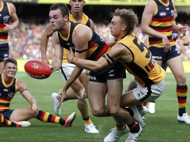 AFL - 23/03/19 - ROUND 1 - Adelaide Crows v Hawthorn at the Adelaide Oval. Brad Crouch under pressure from James Worpel. Picture SARAH REED