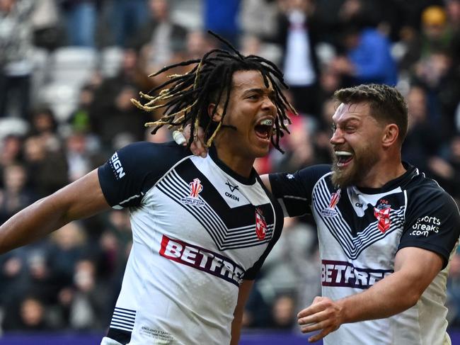 England's Dominic Young (left) celebrates after scoring a try. Picture: AFP