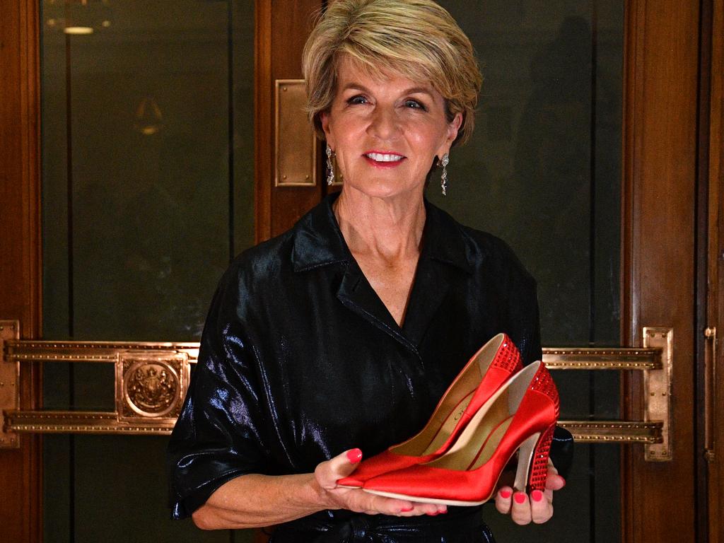 Julie Bishop with the red high heel shoes she donated to the Australian Museum of Democracy. Picture: AAP Image/Mick Tsikas