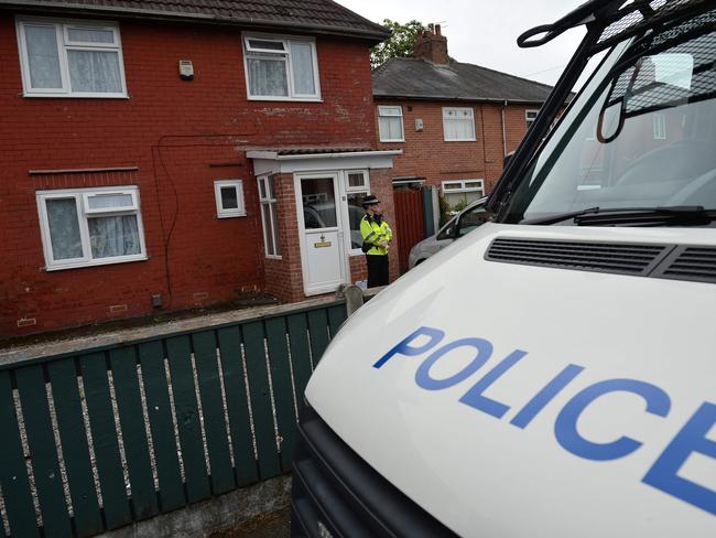 A police officer stands on duty outside the home in Fallowfield, Manchester, where Salman Abedi lived. Picture: AFP/Oli Scarff