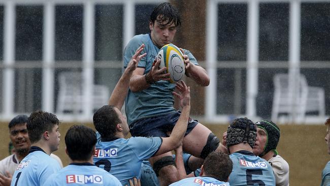 NSW's Quinn Dickinson with the ball for NSW against Queensland.