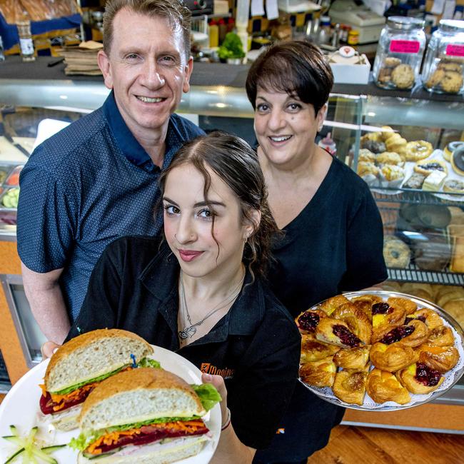 Mario and Kathy Cavuoto and staff member with a turkey and salad roll at Favourite Fillings Sandwich Bar at Gawler Place in the city. Picture: Mark Brake