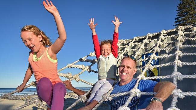 Councillor Jason O'Pray and his daughters Lily, 9, and Jay Jay, 6, try out one of the obstacles that will be part of the Beach Bash at Coolum back in 2014.