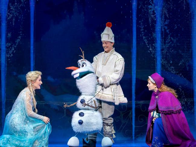 Jemma Rix as Elsa and Courtney Monsma as Anna get reacquainted with Olaf the snowman and his handler Matt Lee.