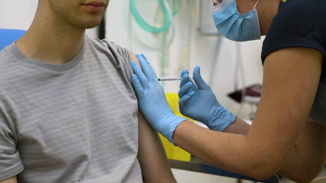 A volunteer is injected with either an experimental COVID-19 vaccine or a comparison shot as part of the first human trials in the UK to test a potential vaccine, led by Oxford University. Picture: AP