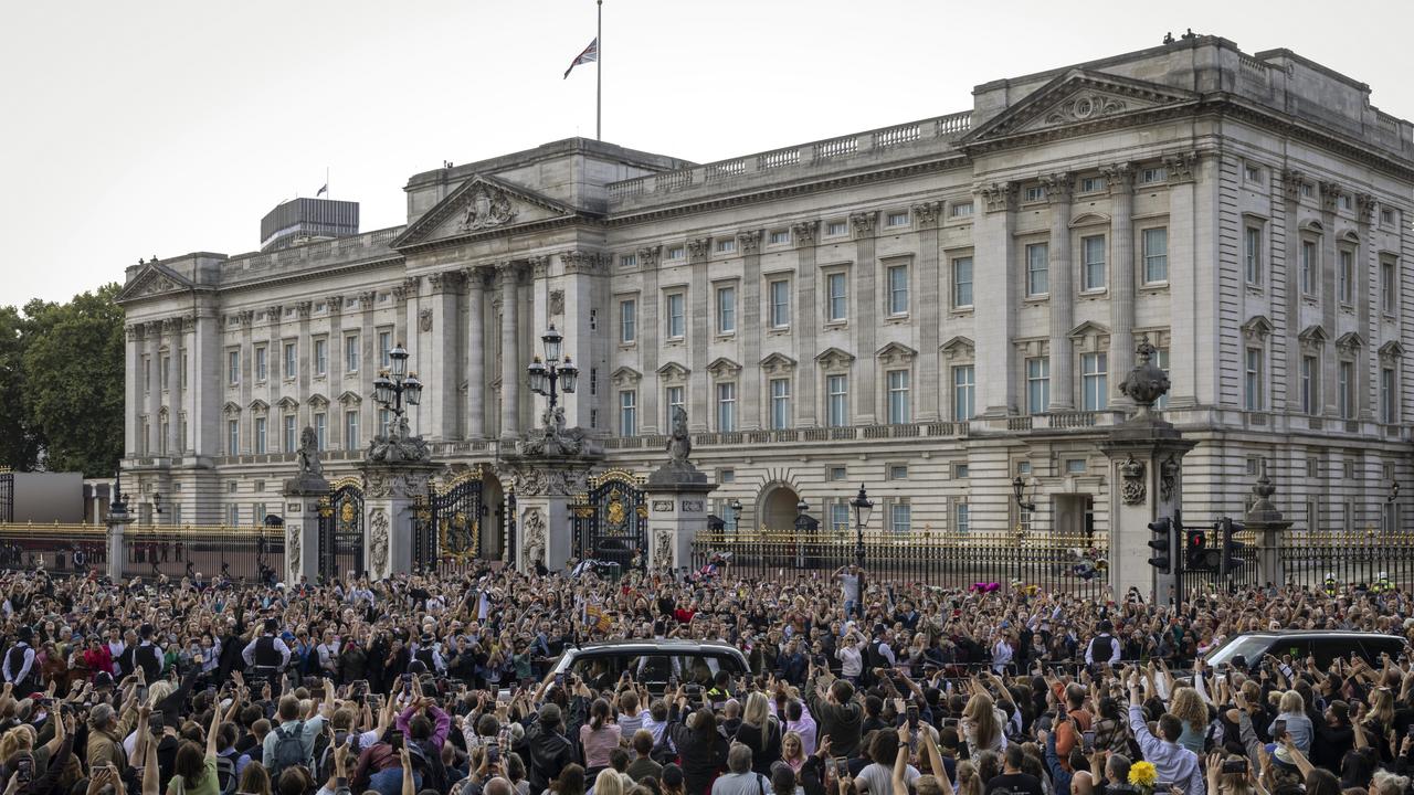 The car carrying King Charles III and Camilla, Queen Consort arrives at Buckingham Palace with the Union Flag at half mast. Picture: AFP