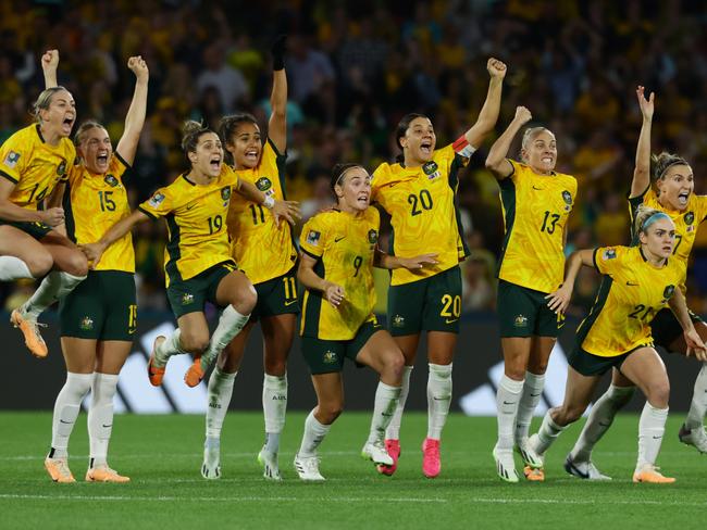 Matildas players celebrate winning the FIFA Womens World Cup Quarter final match between against France at Brisbane Stadium. Picture Lachie Millard