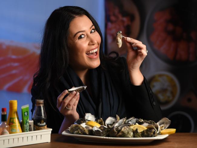 Oyster lover Ava Abiad making the most of her favourite Samtass Bros seafood treat before a predicted shortage. Picture: Naomi Jellicoe