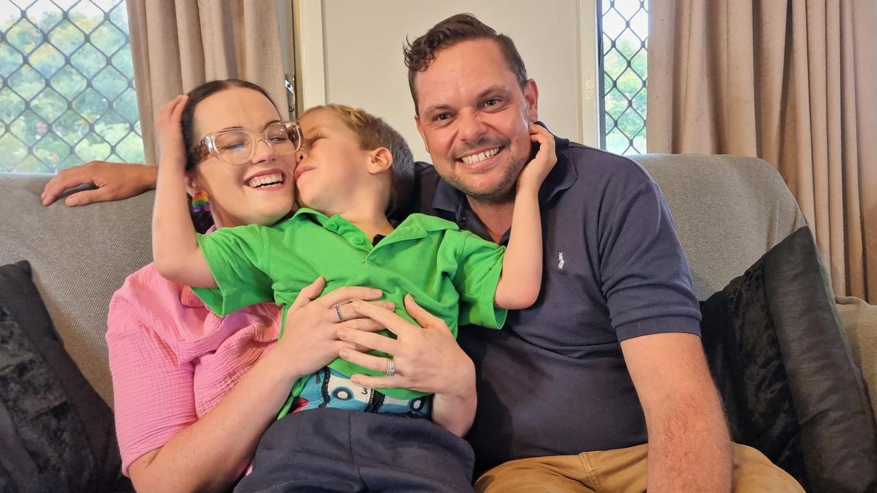 Toowoomba five-year-old Alfie Bell, pictured with his dad Nathan and mum Molly, has currently been left without a school to attend due to his complex disabilities, which have been deemed too difficult for the Diocese of Toowoomba Catholic Schools but are not severe enough for the special schools system.