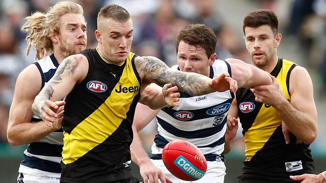 Cam Guthrie, Dustin Martin, Patrick Dangerfield and Trent Cotchin battle for the ball.